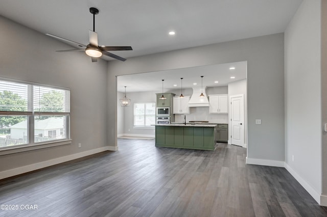 4313 W 28th Pl, Joplin, MO 64804 - unfurnished living room with a ceiling fan, dark wood finished floors, and recessed lighting