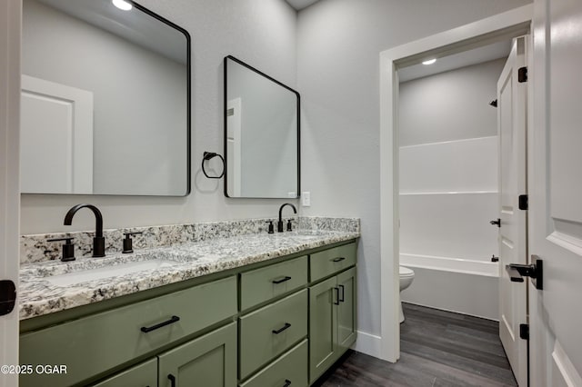 4313 W 28th Pl, Joplin, MO 64804 - bathroom with wood finished floors, double vanity, and shower / tub combination