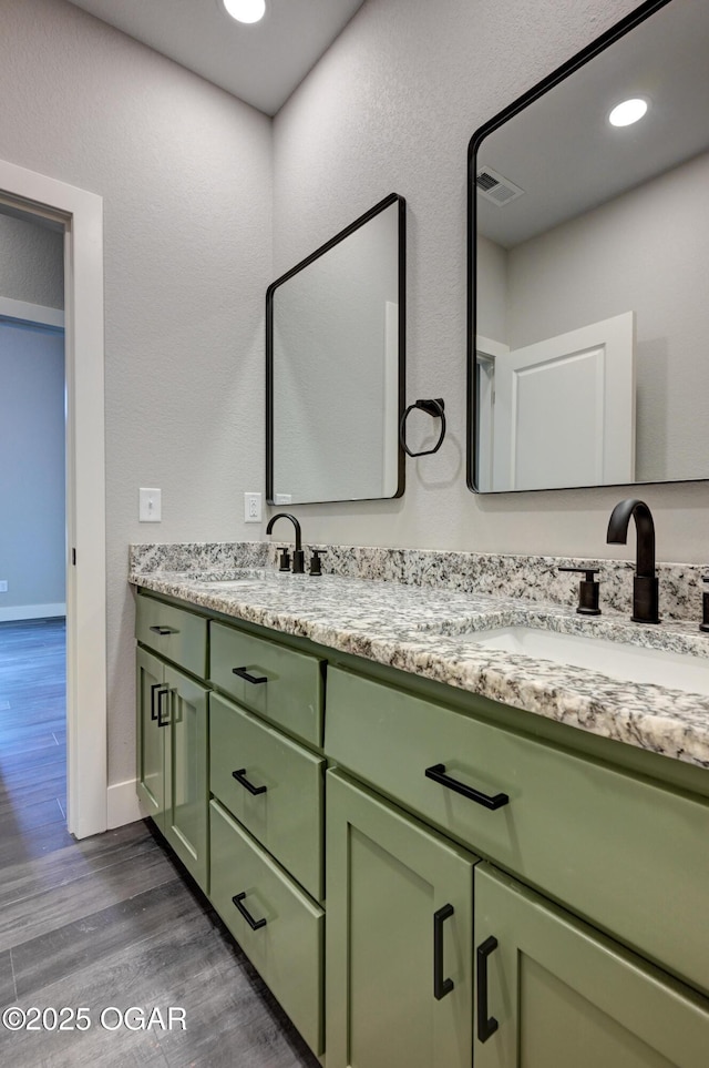 4313 W 28th Pl, Joplin, MO 64804 - bathroom with double vanity and wood finished floors