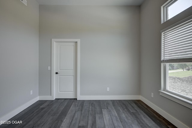 4313 W 28th Pl, Joplin, MO 64804 - unfurnished room featuring dark wood-style flooring and baseboards