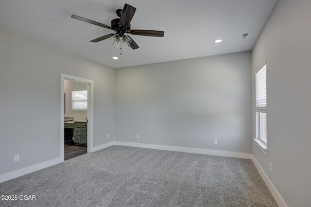 4313 W 28th Pl, Joplin, MO 64804 - spare room with healthy amount of natural light, dark colored carpet, a ceiling fan, and recessed lighting