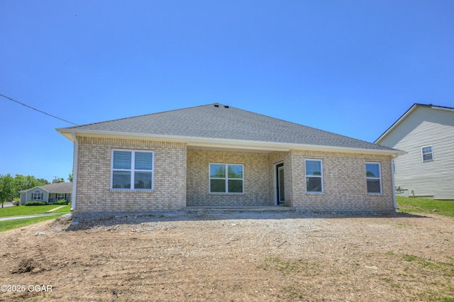 4313 W 28th Pl, Joplin, MO 64804 - rear view of property with brick siding and roof with shingles