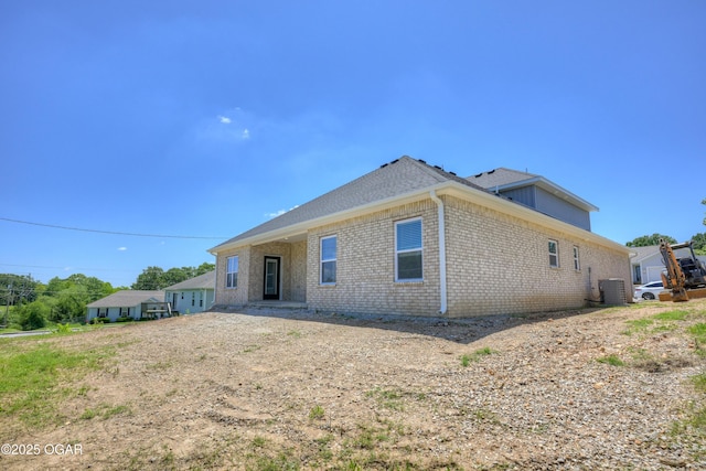 4313 W 28th Pl, Joplin, MO 64804 - rear view of house with brick siding and roof with shingles