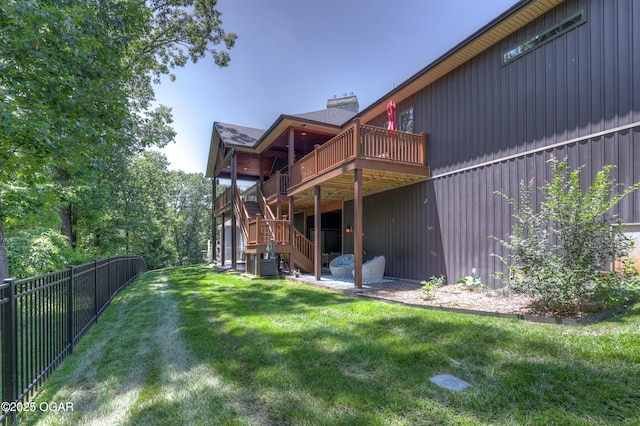 6133 Ridgeview Ct, Joplin, MO 64804 - rear view of property featuring a wooden deck, stairs, and a chimney