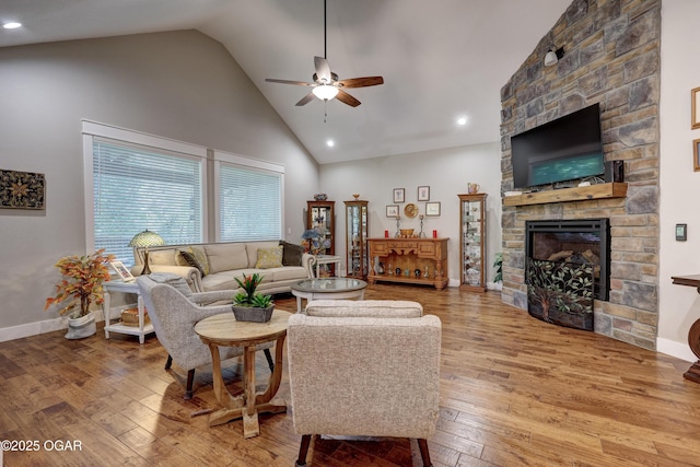6133 Ridgeview Ct, Joplin, MO 64804 - living room featuring a ceiling fan, high vaulted ceiling, light wood-style floors, a fireplace, and recessed lighting