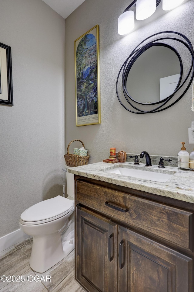 6133 Ridgeview Ct, Joplin, MO 64804 - half bathroom with vanity and wood finished floors