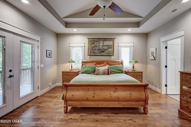 6133 Ridgeview Ct, Joplin, MO 64804 - bedroom featuring access to outside, vaulted ceiling, wood finished floors, recessed lighting, and french doors