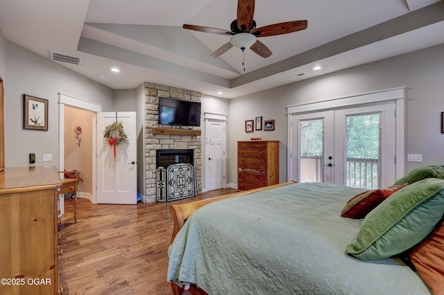 6133 Ridgeview Ct, Joplin, MO 64804 - bedroom with french doors, a tray ceiling, access to outside, light wood-type flooring, and recessed lighting