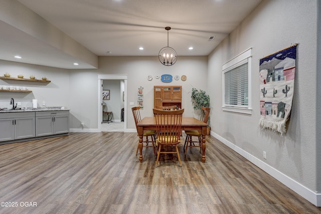 6133 Ridgeview Ct, Joplin, MO 64804 - dining area featuring wood finished floors, recessed lighting, and a chandelier