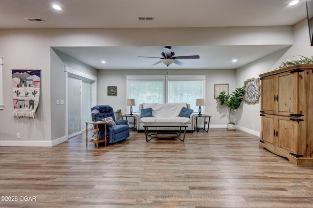 6133 Ridgeview Ct, Joplin, MO 64804 - living room with light wood-style floors, ceiling fan, and recessed lighting