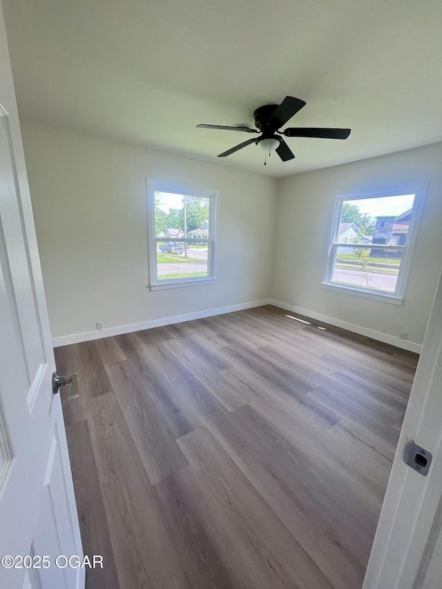 828 S Porter Ave, Joplin, MO 64801 - spare room with healthy amount of natural light, wood finished floors, and ceiling fan