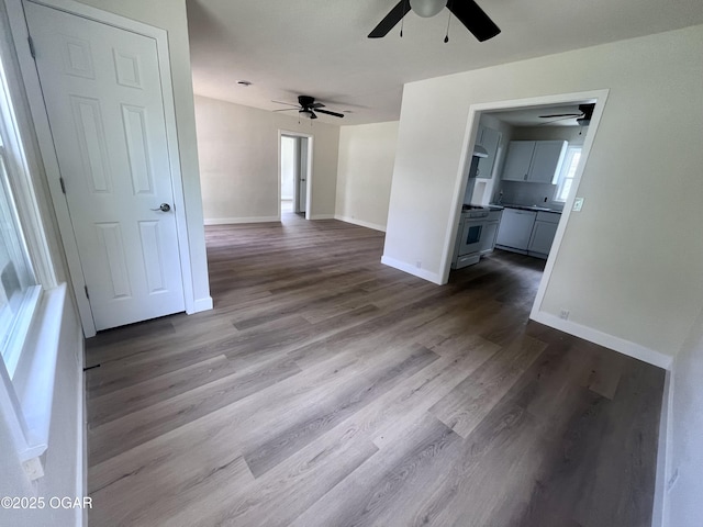 828 S Porter Ave, Joplin, MO 64801 - empty room with a ceiling fan and dark wood-style floors