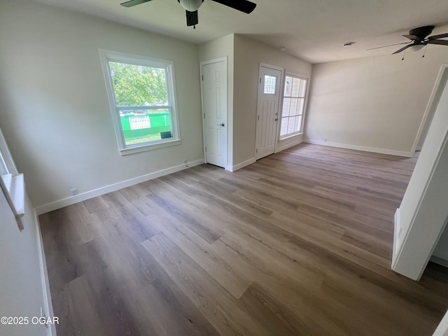 828 S Porter Ave, Joplin, MO 64801 - empty room with ceiling fan and wood finished floors