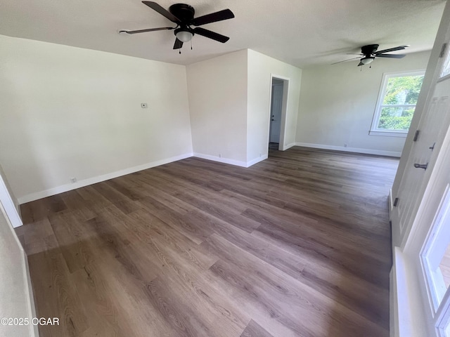 828 S Porter Ave, Joplin, MO 64801 - empty room featuring a ceiling fan and dark wood-style flooring