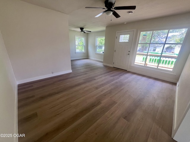 828 S Porter Ave, Joplin, MO 64801 - unfurnished living room featuring wood finished floors and a ceiling fan
