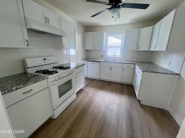 828 S Porter Ave, Joplin, MO 64801 - kitchen featuring white appliances, premium range hood, stone counters, backsplash, and white cabinetry
