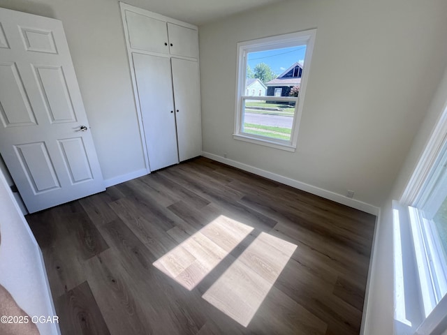 828 S Porter Ave, Joplin, MO 64801 - unfurnished bedroom featuring wood finished floors and a closet