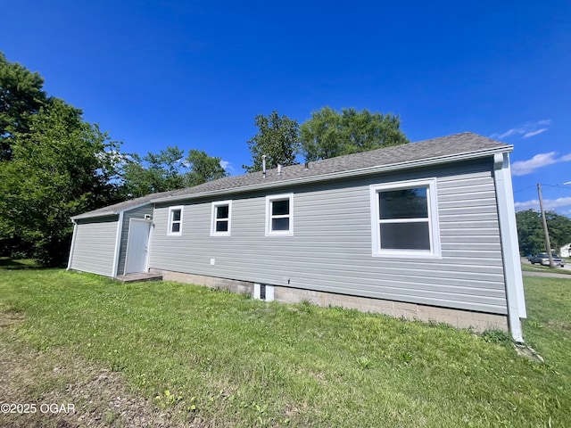 828 S Porter Ave, Joplin, MO 64801 - back of house with a yard and roof with shingles