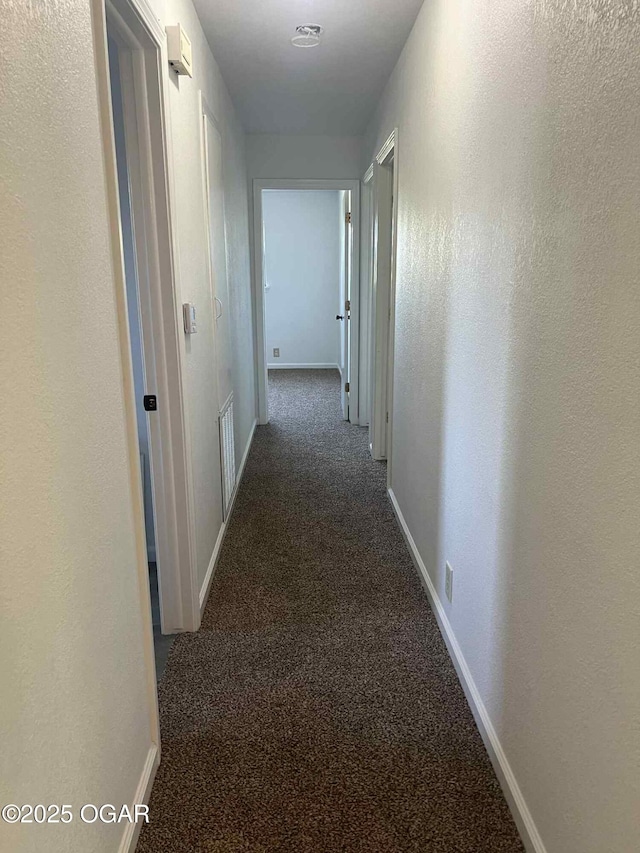 1617 Massachusetts Ave, Joplin, MO 64804 - corridor with dark colored carpet and baseboards