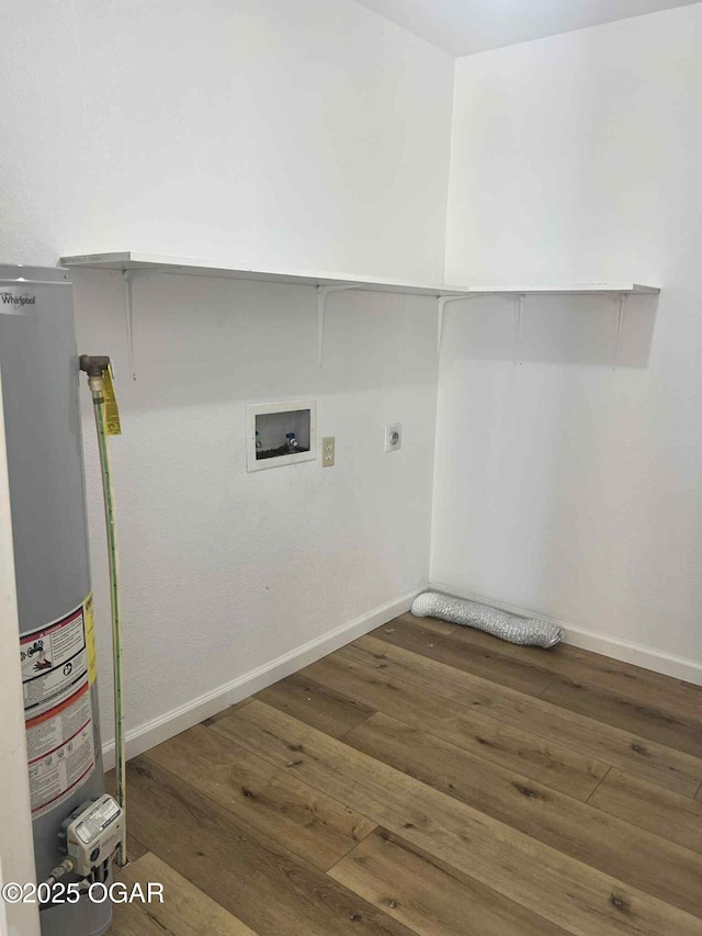 1617 Massachusetts Ave, Joplin, MO 64804 - washroom featuring hookup for an electric dryer, gas water heater, washer hookup, and wood finished floors