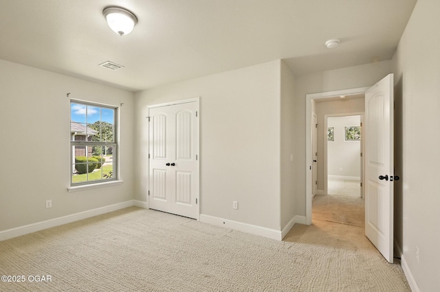 305 Dogwood Trails Loop, Carl Junction, MO 64834 - unfurnished bedroom featuring light colored carpet and a closet