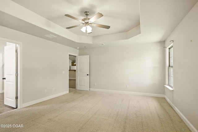 305 Dogwood Trails Loop, Carl Junction, MO 64834 - unfurnished bedroom with a raised ceiling, light colored carpet, and ceiling fan