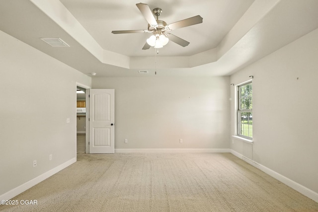 305 Dogwood Trails Loop, Carl Junction, MO 64834 - spare room featuring a raised ceiling, light colored carpet, and a ceiling fan