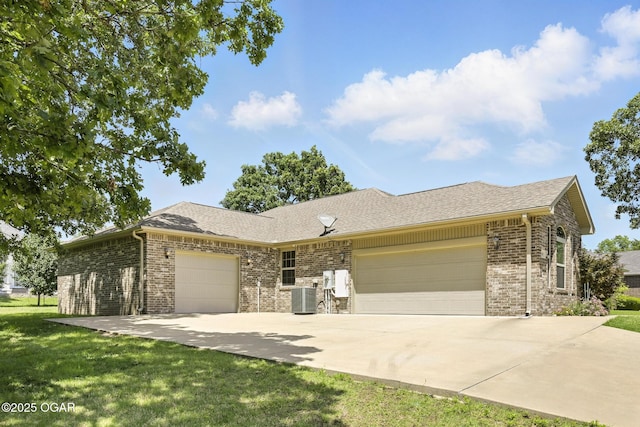 305 Dogwood Trails Loop, Carl Junction, MO 64834 - ranch-style house with a garage, brick siding, driveway, a front yard, and a shingled roof