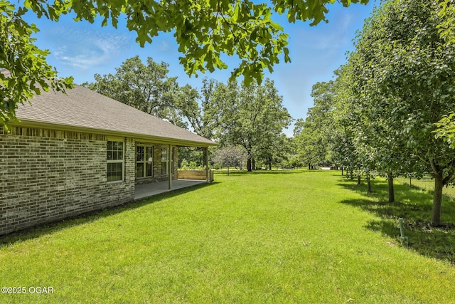 305 Dogwood Trails Loop, Carl Junction, MO 64834 - view of grassy yard featuring a patio
