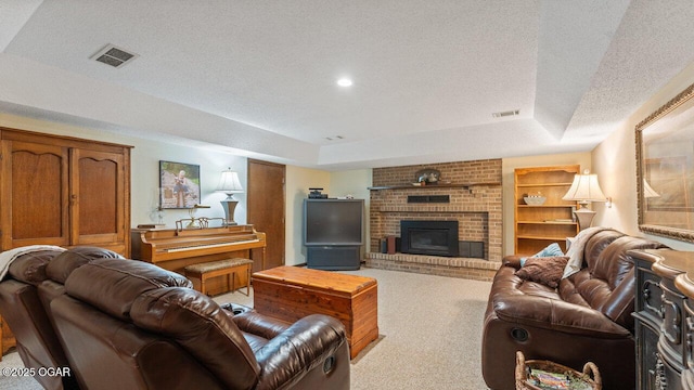 21974 S 1825th Rd, Milo, MO 64767 - carpeted living area with a textured ceiling, a raised ceiling, and a brick fireplace