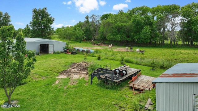 21974 S 1825th Rd, Milo, MO 64767 - view of grassy yard featuring an outbuilding and view of wooded area