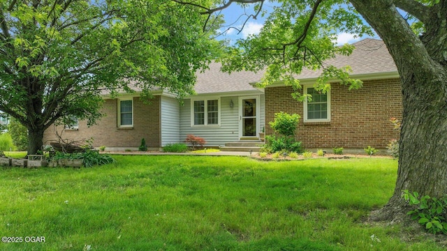 21974 S 1825th Rd, Milo, MO 64767 - view of front facade with brick siding, a front lawn, and roof with shingles
