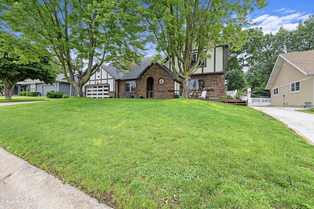 3502 Hackberry Ln, Joplin, MO 64801 - tudor house featuring brick siding and a garage