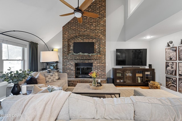 3502 Hackberry Ln, Joplin, MO 64801 - living area with a ceiling fan, wood finished floors, a brick fireplace, and high vaulted ceiling