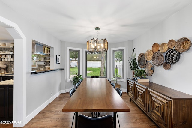3502 Hackberry Ln, Joplin, MO 64801 - dining room with a chandelier and dark wood-style flooring