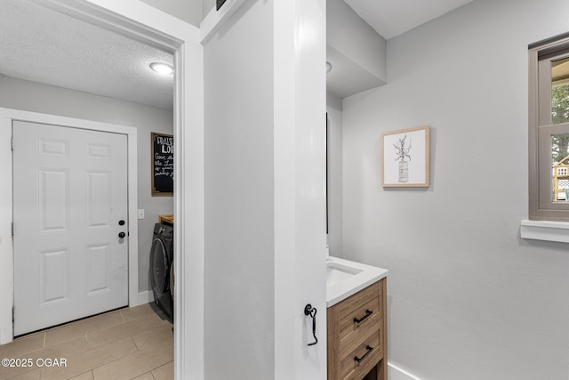 3502 Hackberry Ln, Joplin, MO 64801 - bathroom with vanity, separate washer and dryer, and tile patterned floors