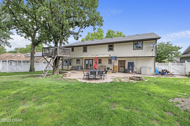 3502 Hackberry Ln, Joplin, MO 64801 - back of property featuring a fenced backyard, stairway, a deck, a patio area, and a gate