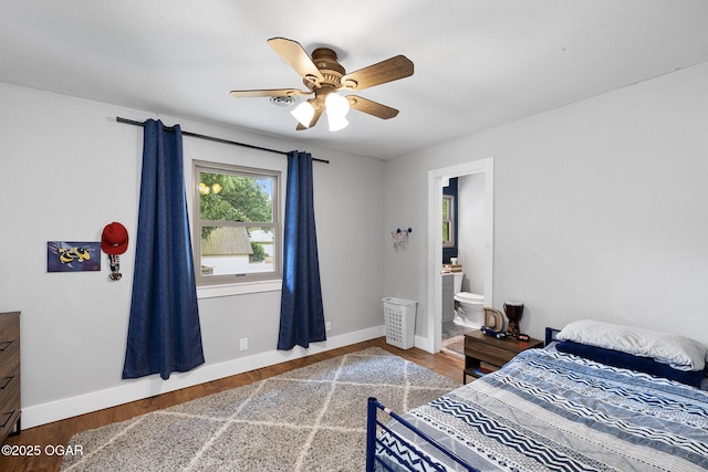 3502 Hackberry Ln, Joplin, MO 64801 - bedroom featuring wood finished floors, connected bathroom, and a ceiling fan