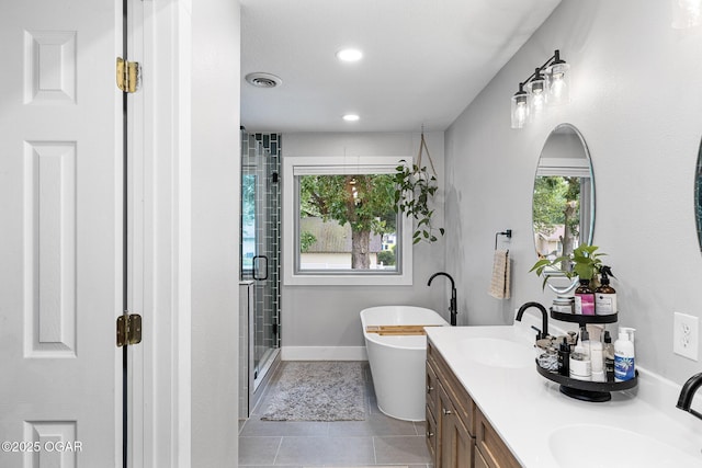 3502 Hackberry Ln, Joplin, MO 64801 - bathroom with a soaking tub, a shower stall, double vanity, tile patterned flooring, and recessed lighting