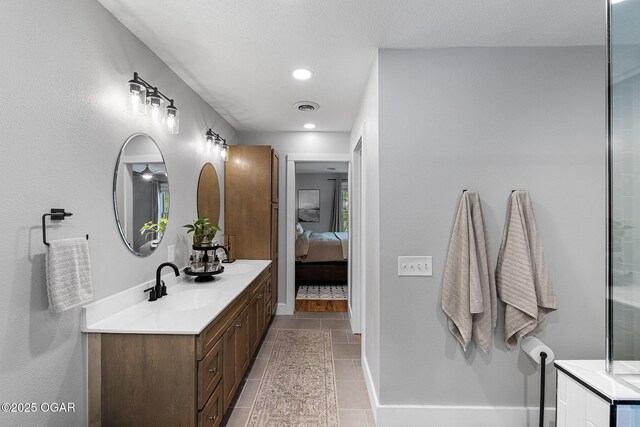 3502 Hackberry Ln, Joplin, MO 64801 - bathroom with double vanity, tile patterned floors, and ensuite bath