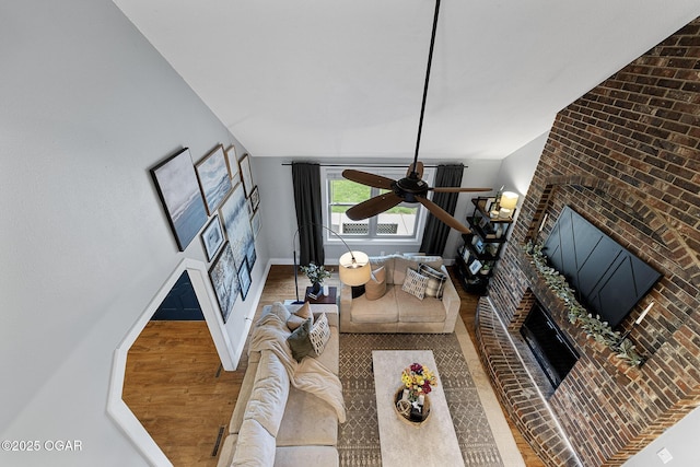 3502 Hackberry Ln, Joplin, MO 64801 - living room with a brick fireplace, a ceiling fan, wood finished floors, and lofted ceiling