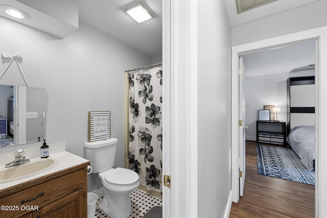 3502 Hackberry Ln, Joplin, MO 64801 - ensuite bathroom with vanity and wood finished floors