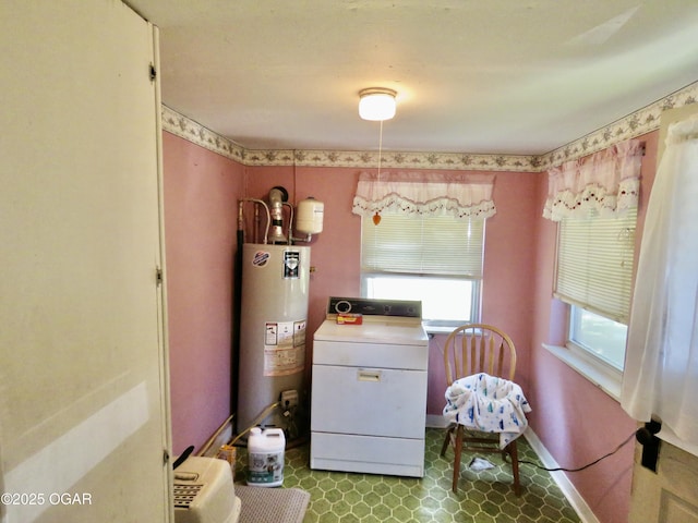 722 E Budlong St, Carthage, MO 64836 - bedroom with gas water heater and washer / dryer