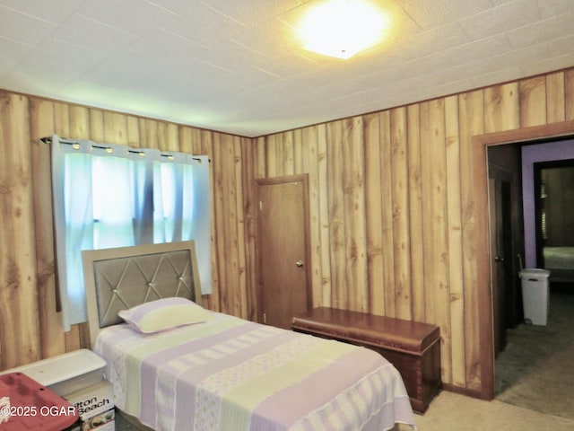 722 E Budlong St, Carthage, MO 64836 - bedroom with wooden walls and light colored carpet
