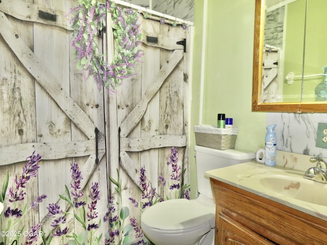 722 E Budlong St, Carthage, MO 64836 - bathroom with vanity and toilet