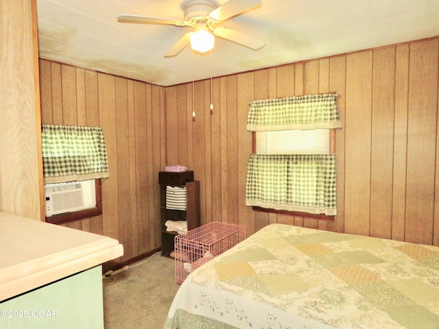 722 E Budlong St, Carthage, MO 64836 - carpeted bedroom with wooden walls and ceiling fan