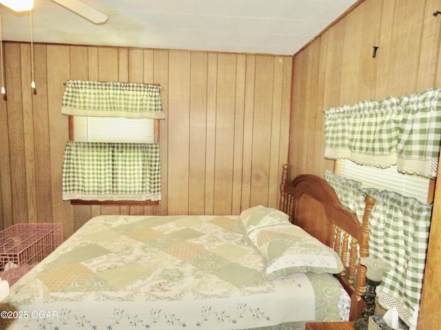 722 E Budlong St, Carthage, MO 64836 - bedroom with wood walls and ceiling fan
