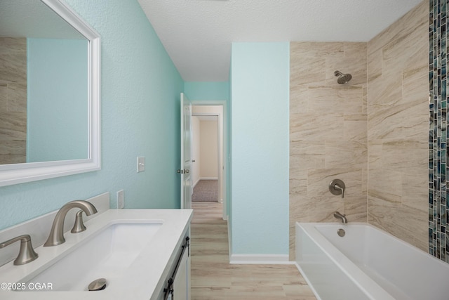 303 Water St, Exeter, MO 65647 - bathroom featuring wood finished floors, vanity, shower / washtub combination, and a textured ceiling