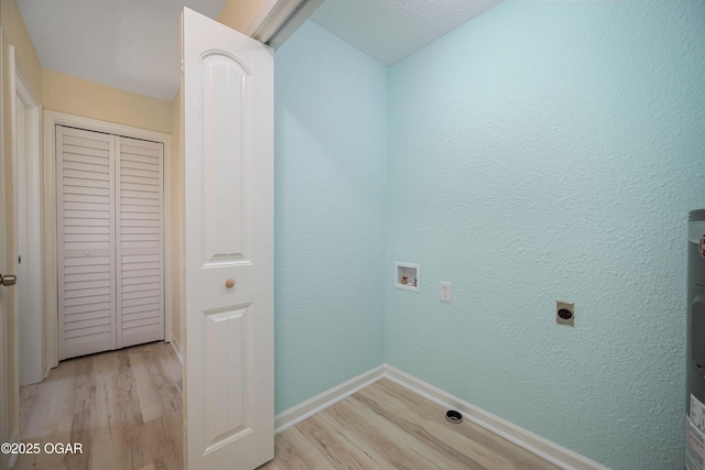 303 Water St, Exeter, MO 65647 - washroom with light wood-style flooring, electric dryer hookup, and hookup for a washing machine