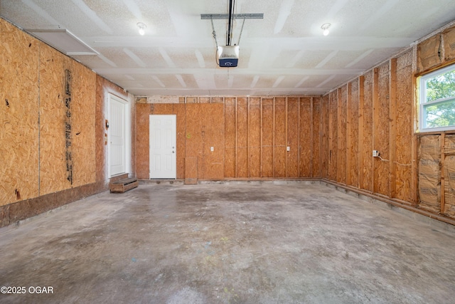 303 Water St, Exeter, MO 65647 - garage featuring a garage door opener